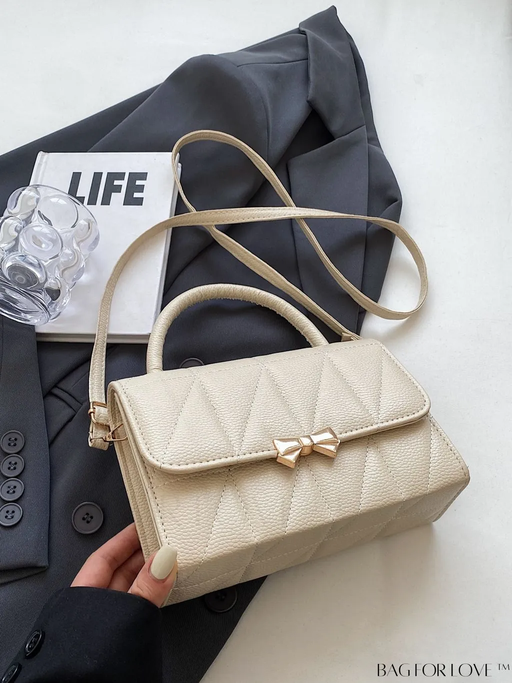 BagForLove - Chic Flap Handbag with Stylish Stitching, Bow Detail, and Adjustable Strap