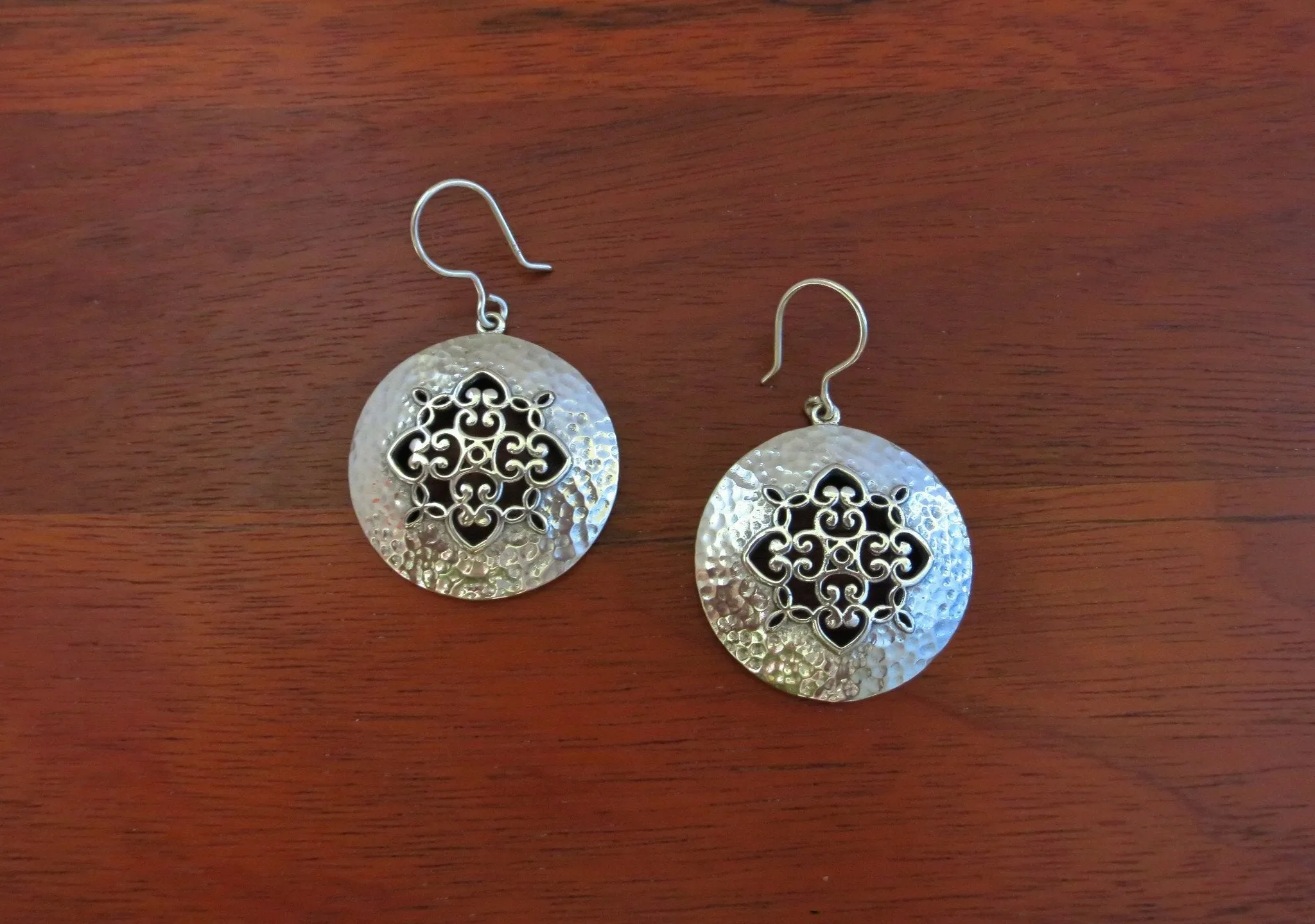 Soulful and chic, Kutch-inspired jali and hammer finish round earrings