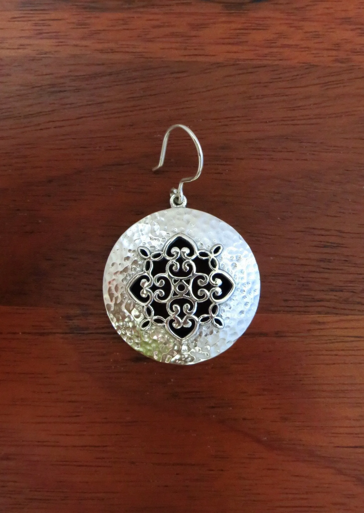 Soulful and chic, Kutch-inspired jali and hammer finish round earrings